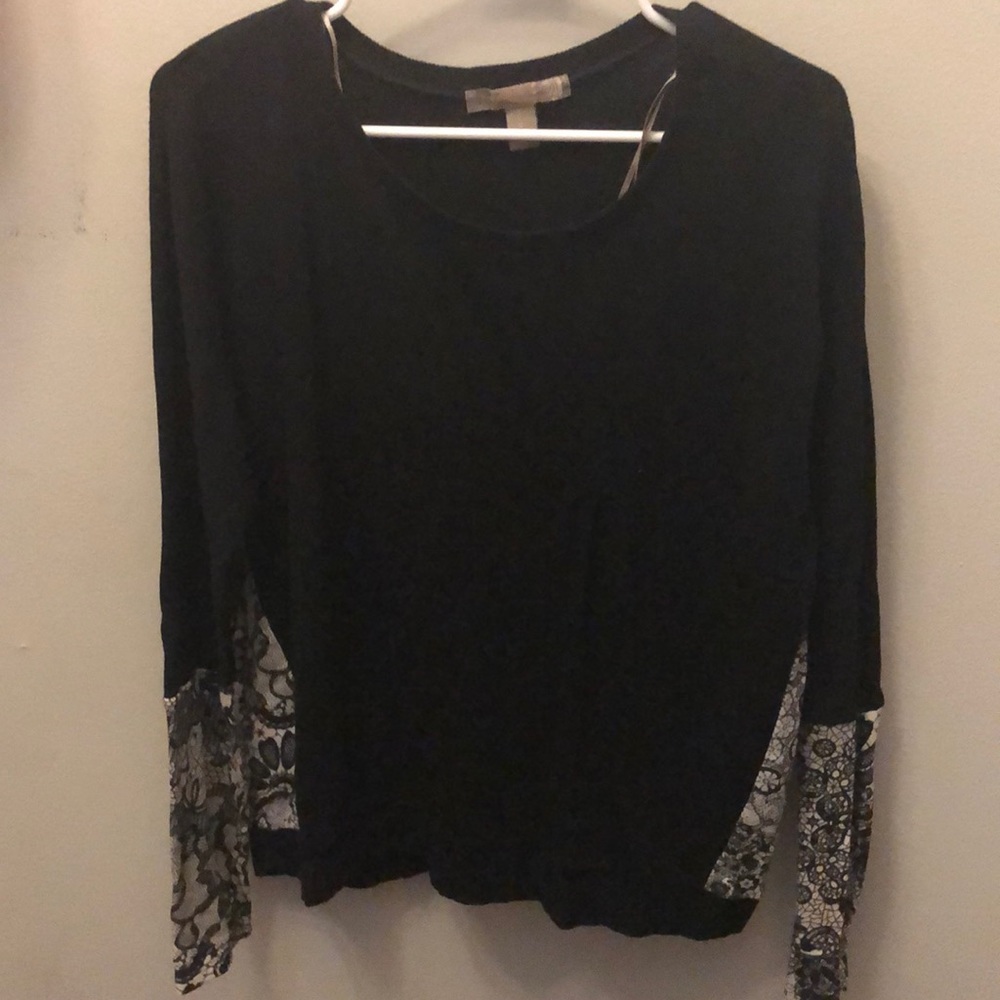 Black crewneck sweater.